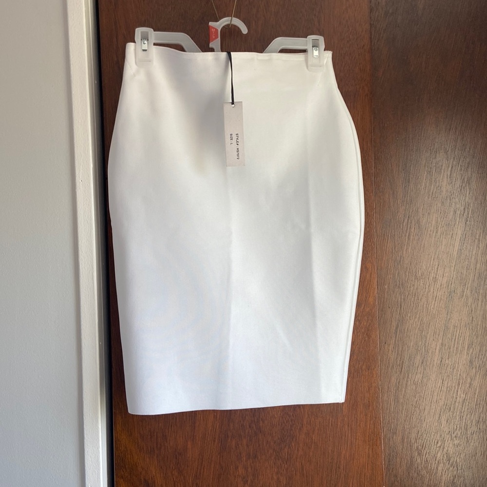 White knee length pencil skirt.